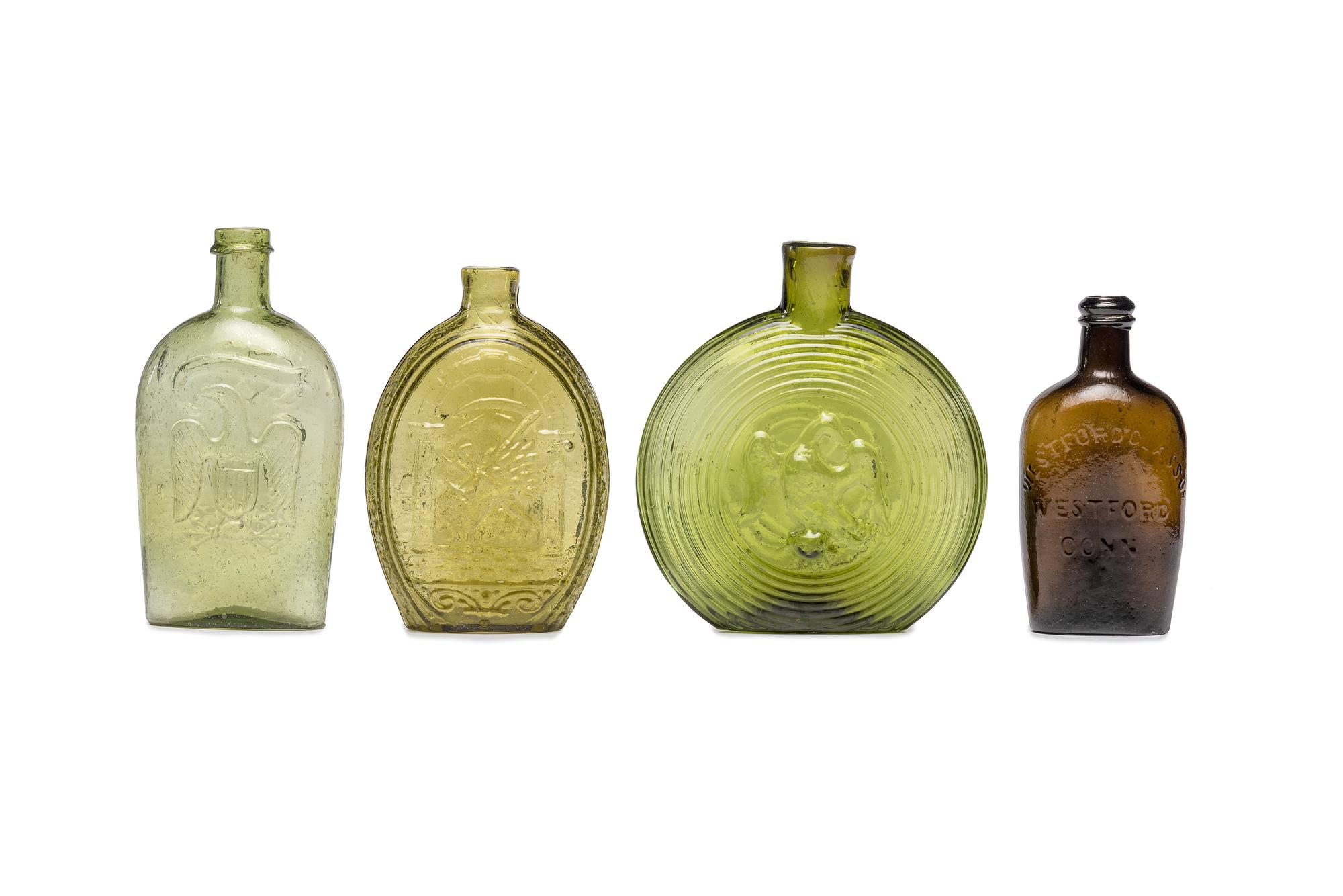Four Molded Glass Amber and Green Flasks