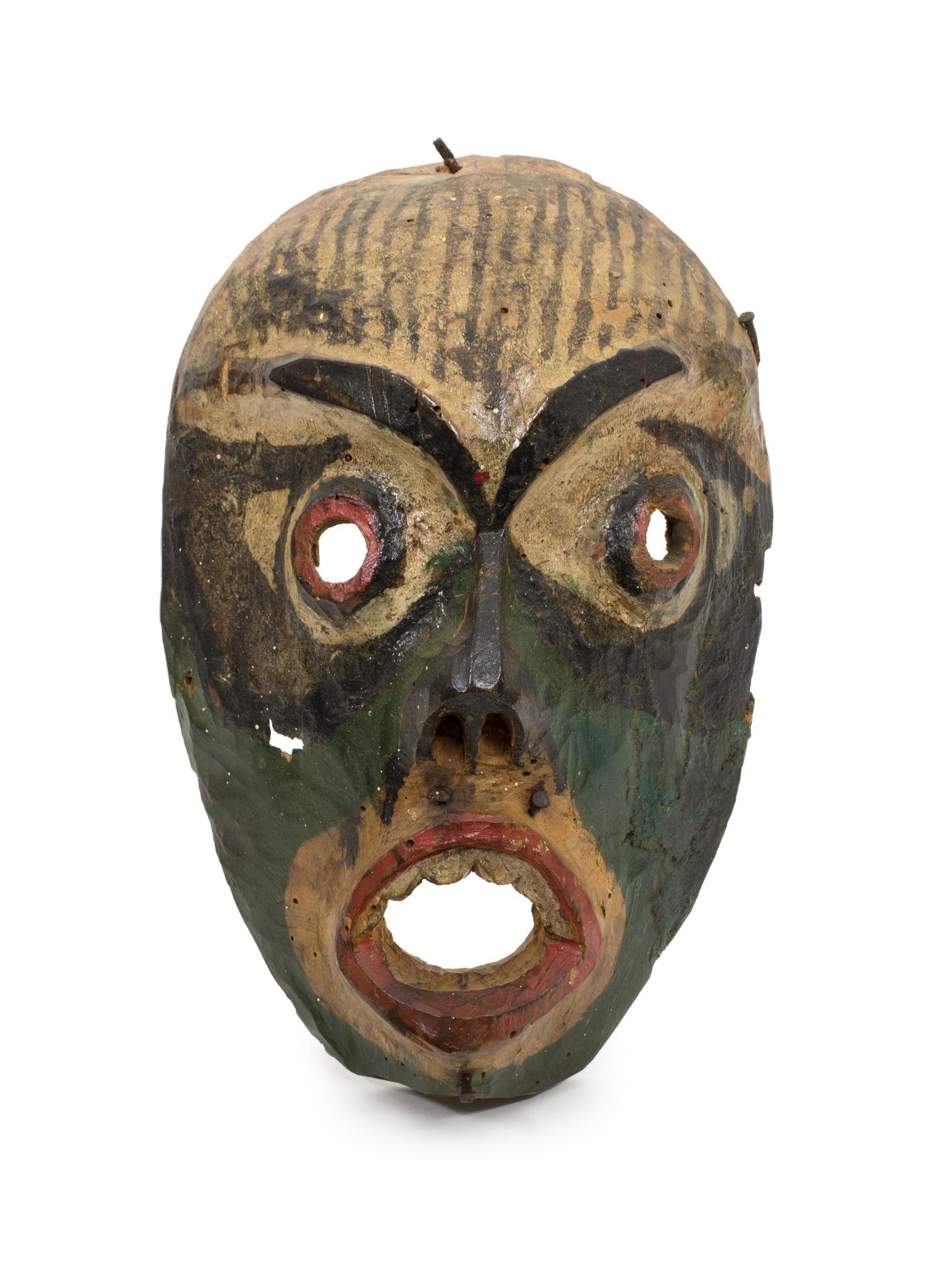 A Kwakwaka'wakw Painted Carved Wood Mask Height 10 1/4 x width 7 1/4 x depth 3 1/4 inches. — EARLY 20TH CENTURY