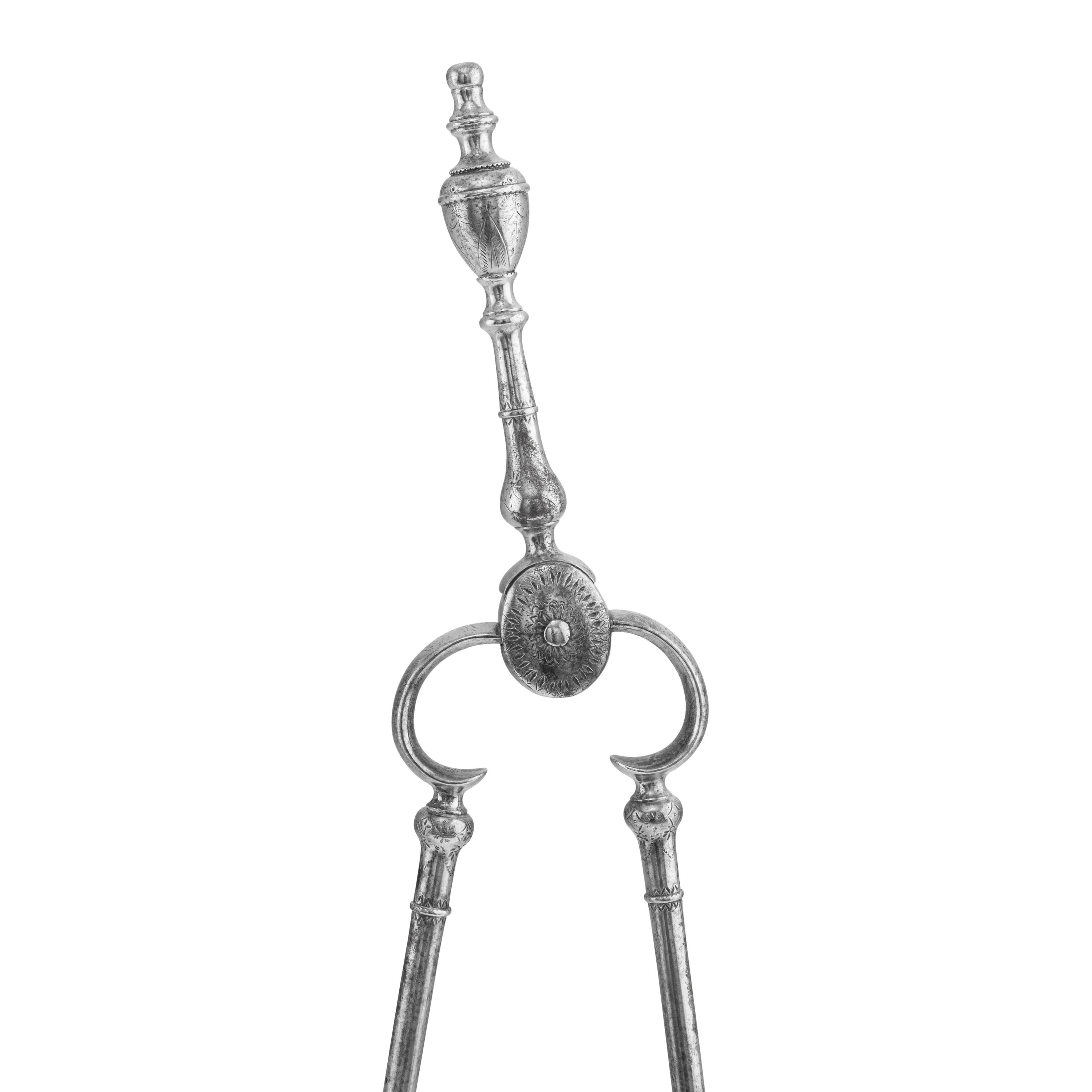 A George III Steel Serpentine Fender and Fireplace Tools
