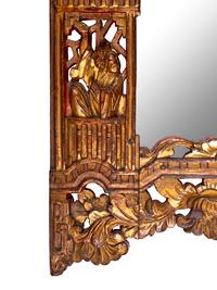 A Chinese Red and Gilt Lacquered Carved Wood Mirror