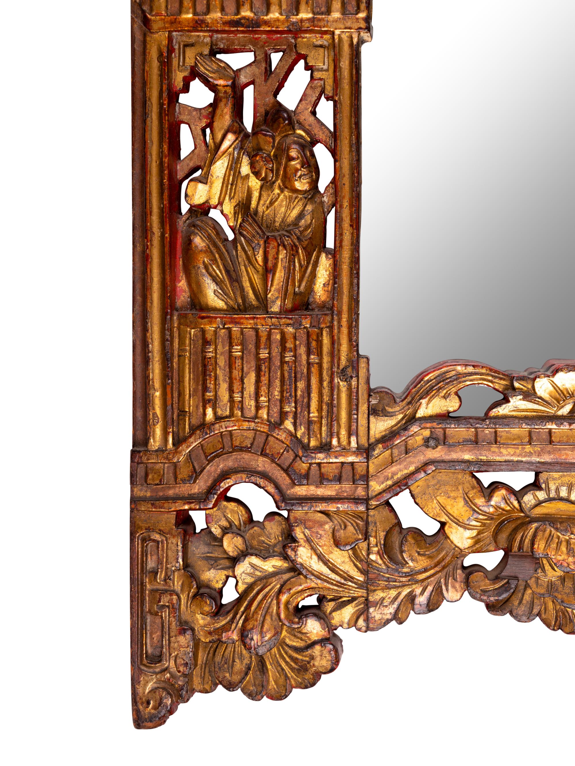 A Chinese Red and Gilt Lacquered Carved Wood Mirror