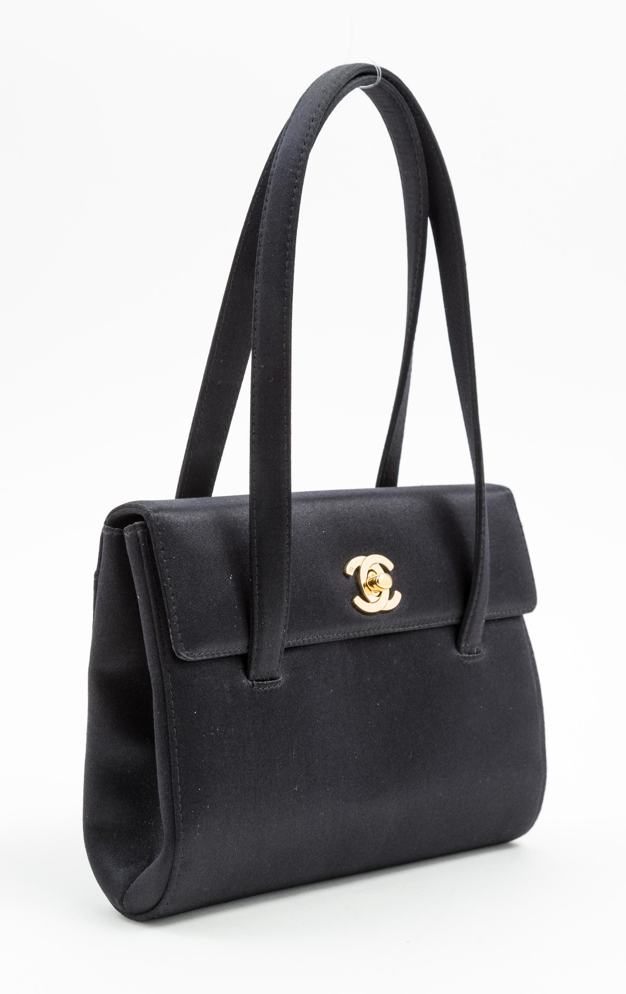 A Chanel Black Satin Small Flap Handbag, 7.5" x 5.5" x 1.75"; Handle drop: 5.5".