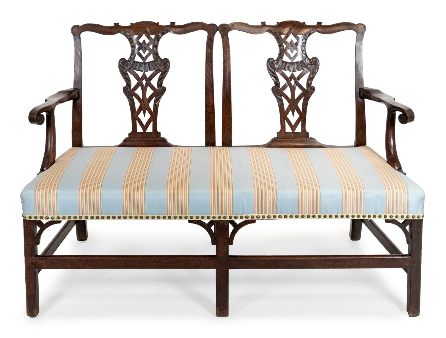 A George III Carved Mahogany Settee