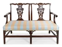 A George III Carved Mahogany Settee