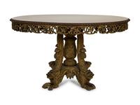 An Anglo-Indian Carved and Parcel Gilt Tilt-Top Table with Lion Form Feet