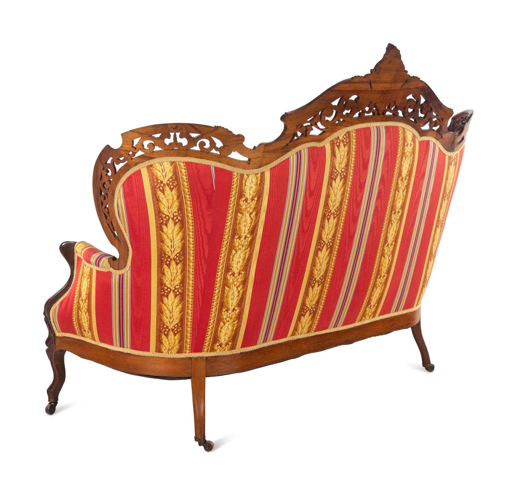 A Renaissance Revival Laminated and Carved Rosewood Three-Piece Parlor Suite