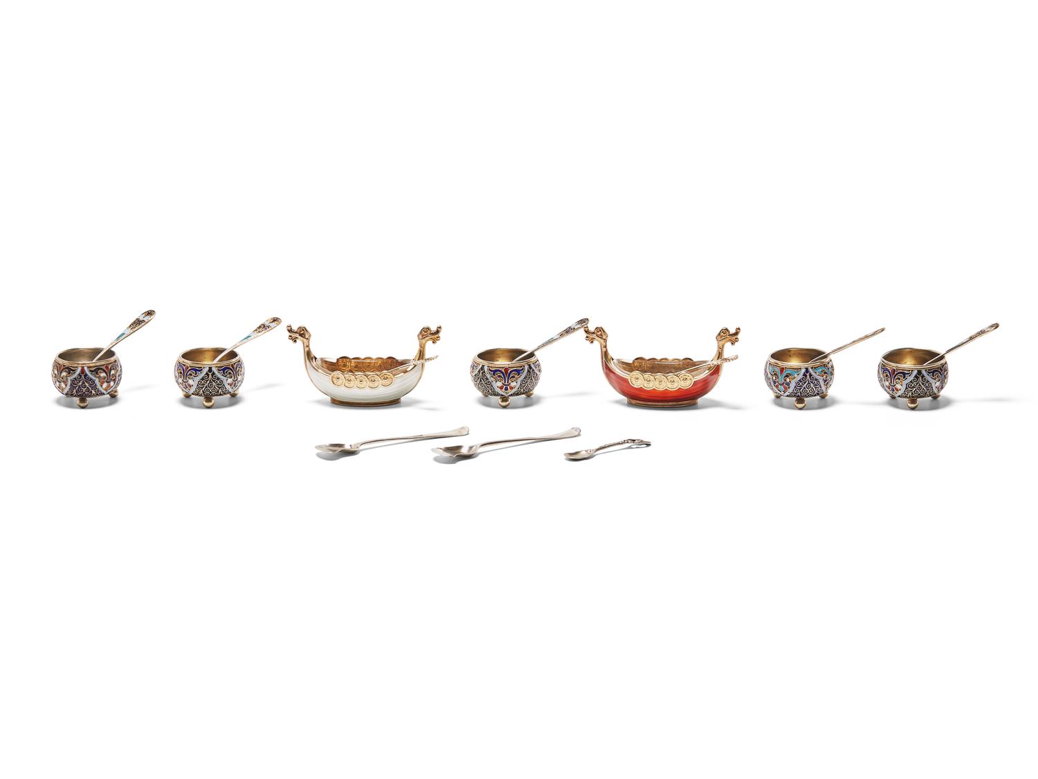 An Assembled Set of Seven Silver and Enameled Salt Cellars with Spoons