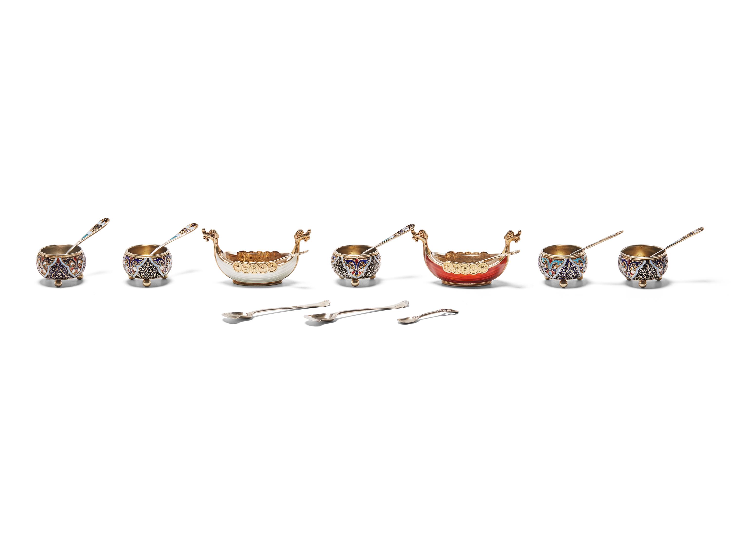 An Assembled Set of Seven Silver and Enameled Salt Cellars with Spoons