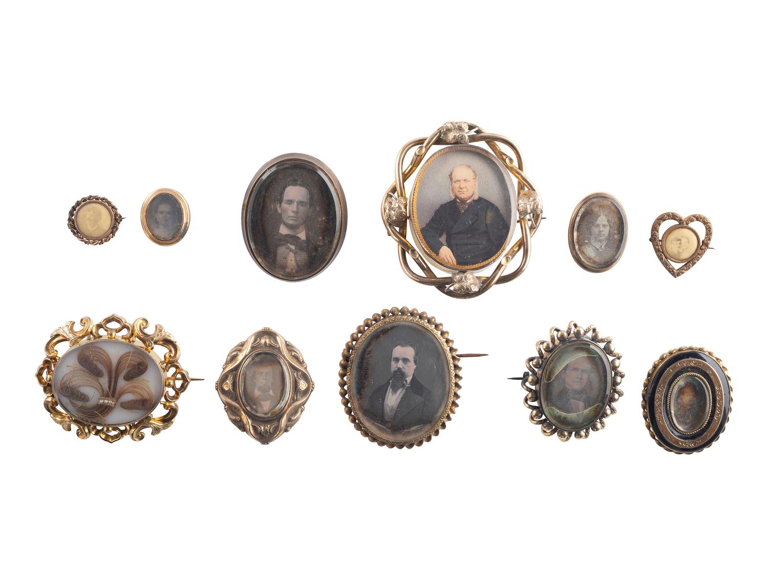 [EARLY PHOTOGRAPHY]. A group of 11 daguerreian brooches containing 13 portraits of men and women.