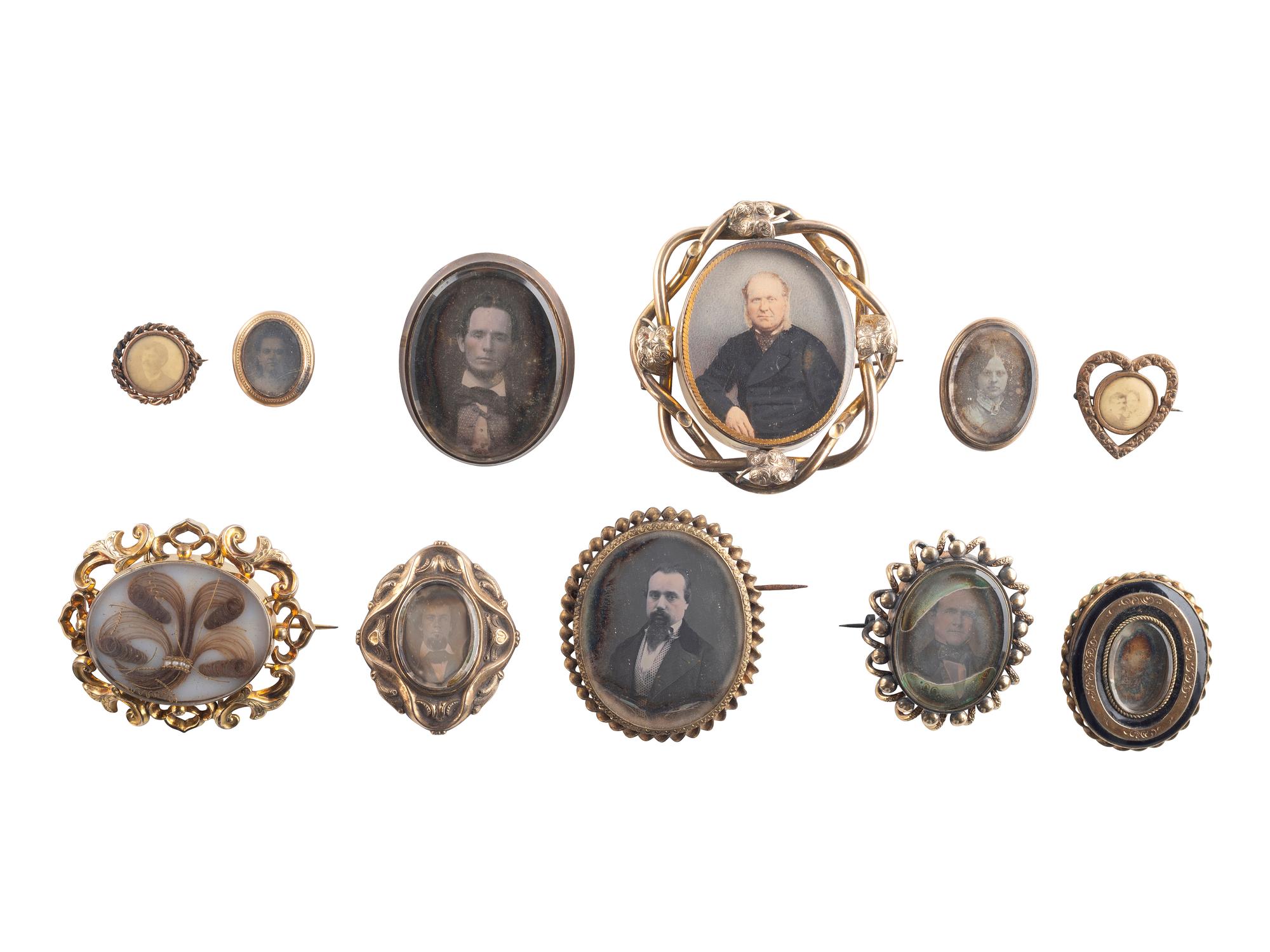 [EARLY PHOTOGRAPHY]. A group of 11 daguerreian brooches containing 13 portraits of men and women.