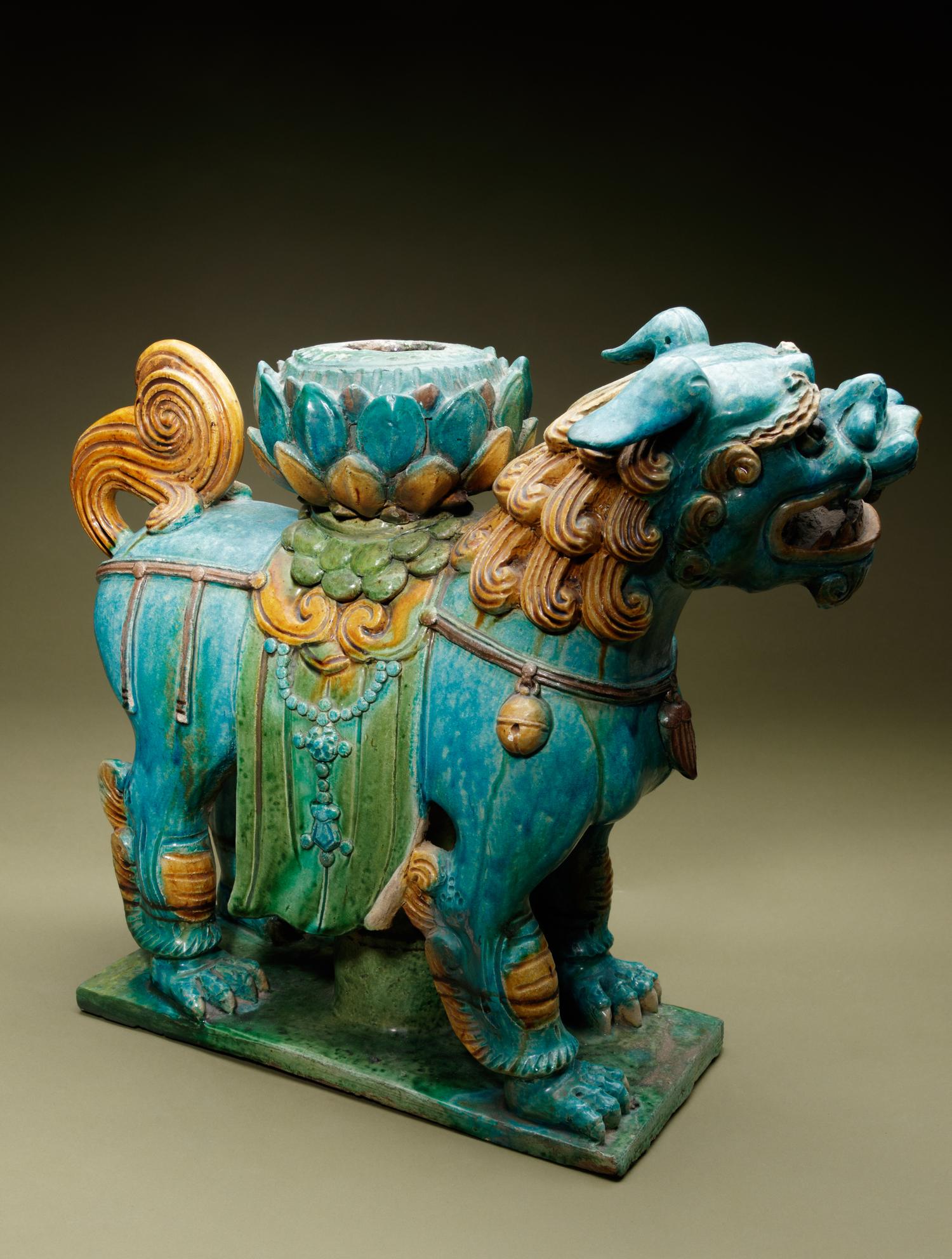 A Turquoise, Ochre and Green Glazed Tileworks 'Fu Lion' Stand