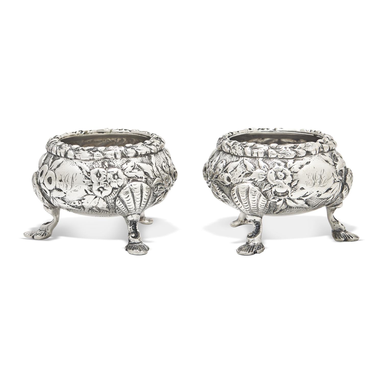 A Pair of Sterling Silver Floral Repousse Salt Cellars