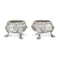 A Pair of Sterling Silver Floral Repousse Salt Cellars