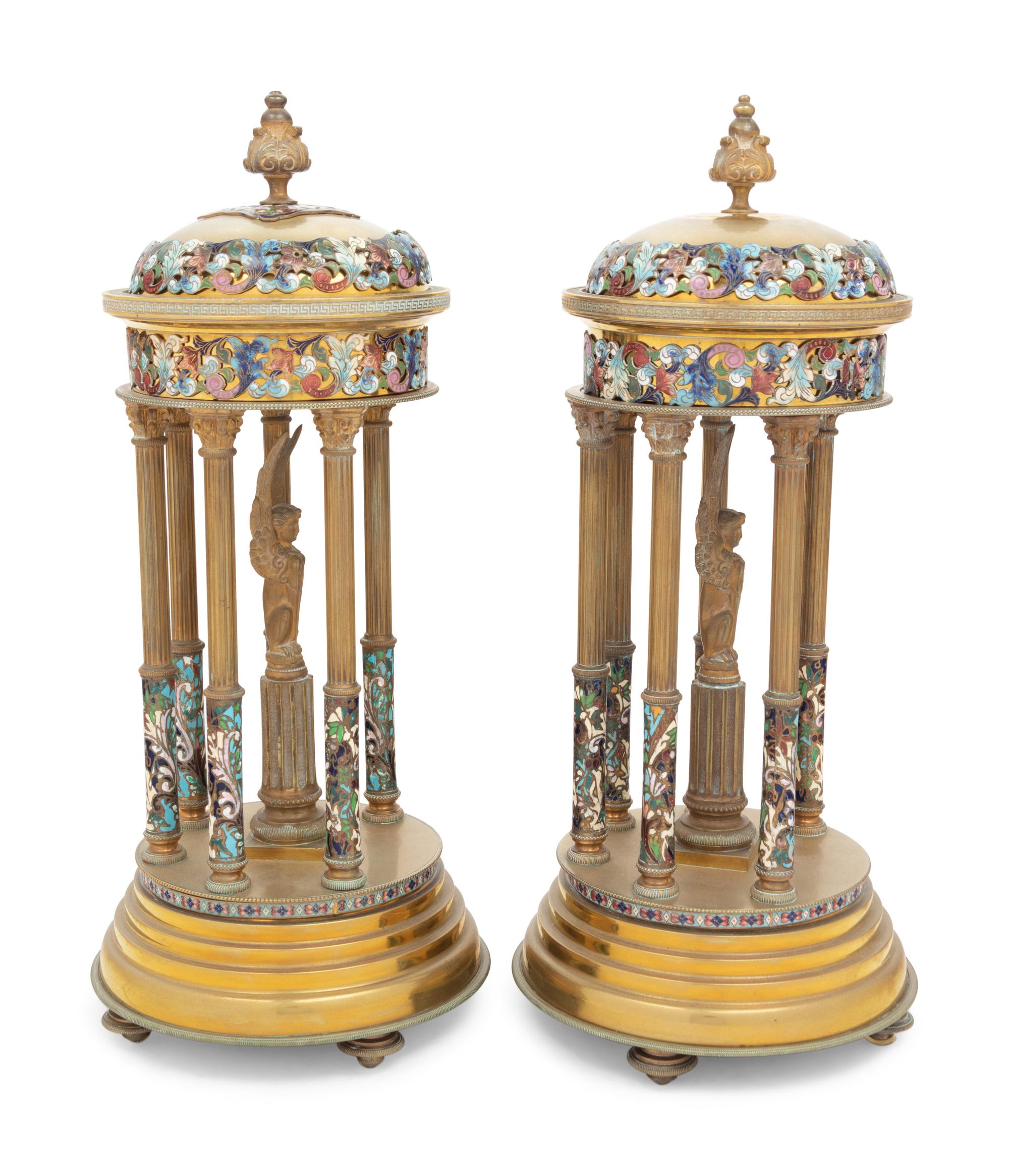 A Pair of French Gilt Bronze and Champlevé Enamel Stands with Interior Sphinxes