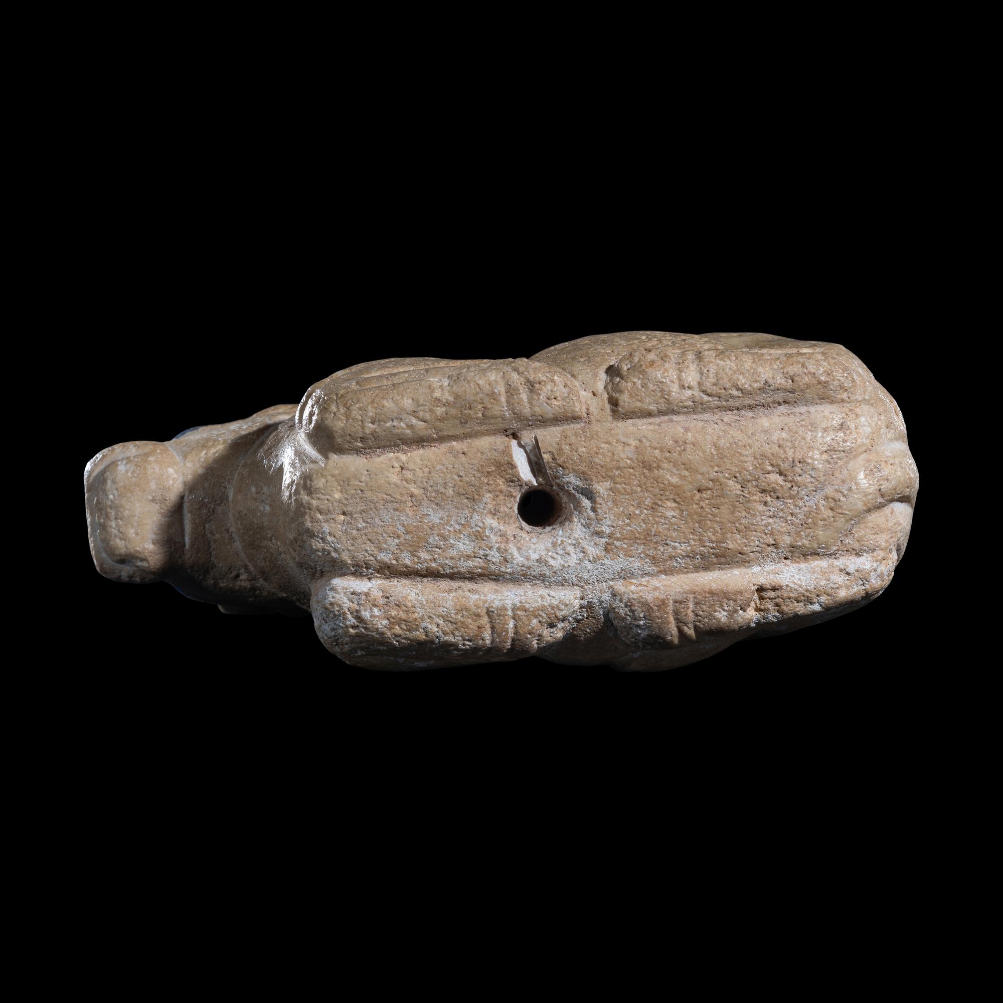 A Mesopotamian Limestone Recumbent Bull with Lapis Lazuli Inlays