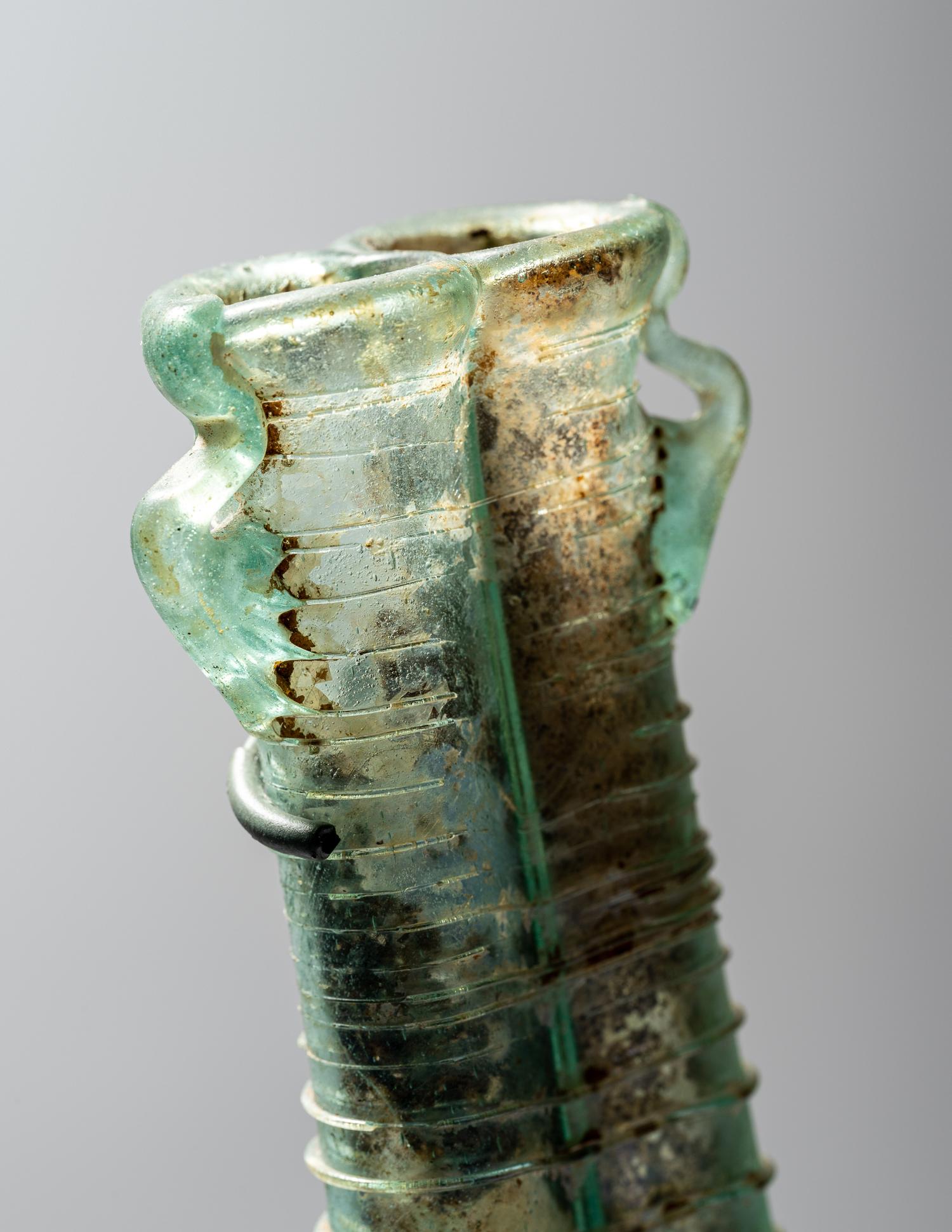 A Roman Pale Blue Glass Double Unguentarium