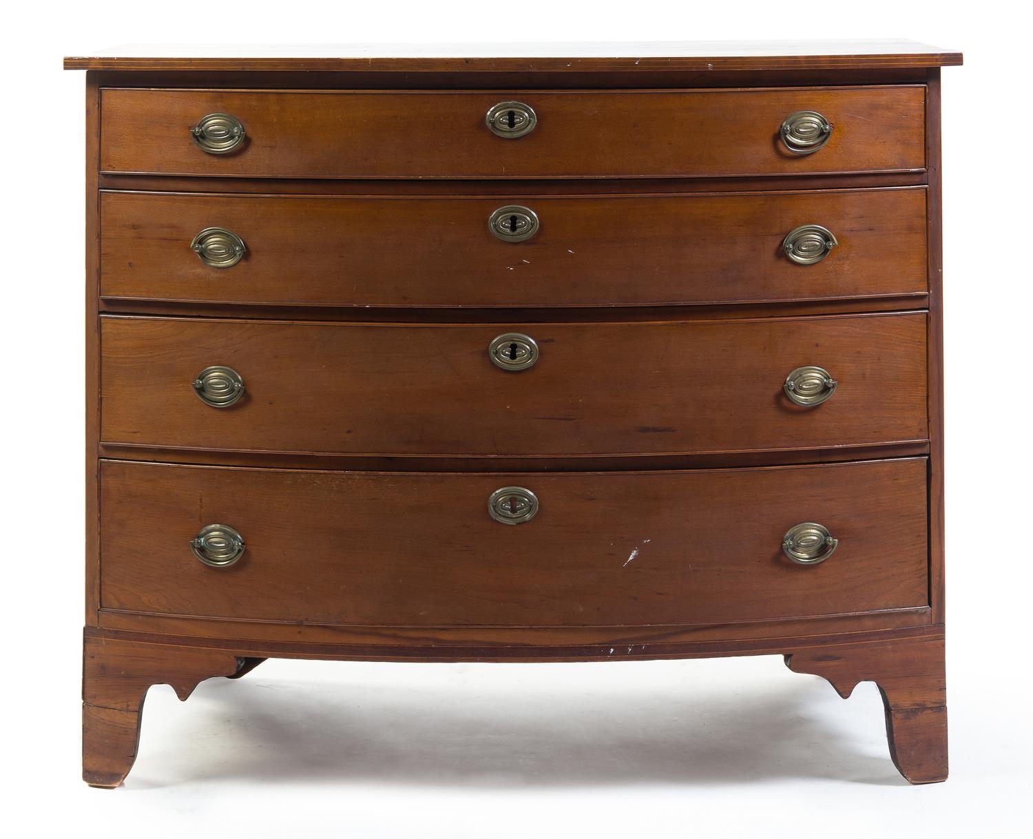 An American Walnut Bowfront Chest of Drawers Height 33 1/2 x width 41 1/2 x depth 22 3/8 inches.