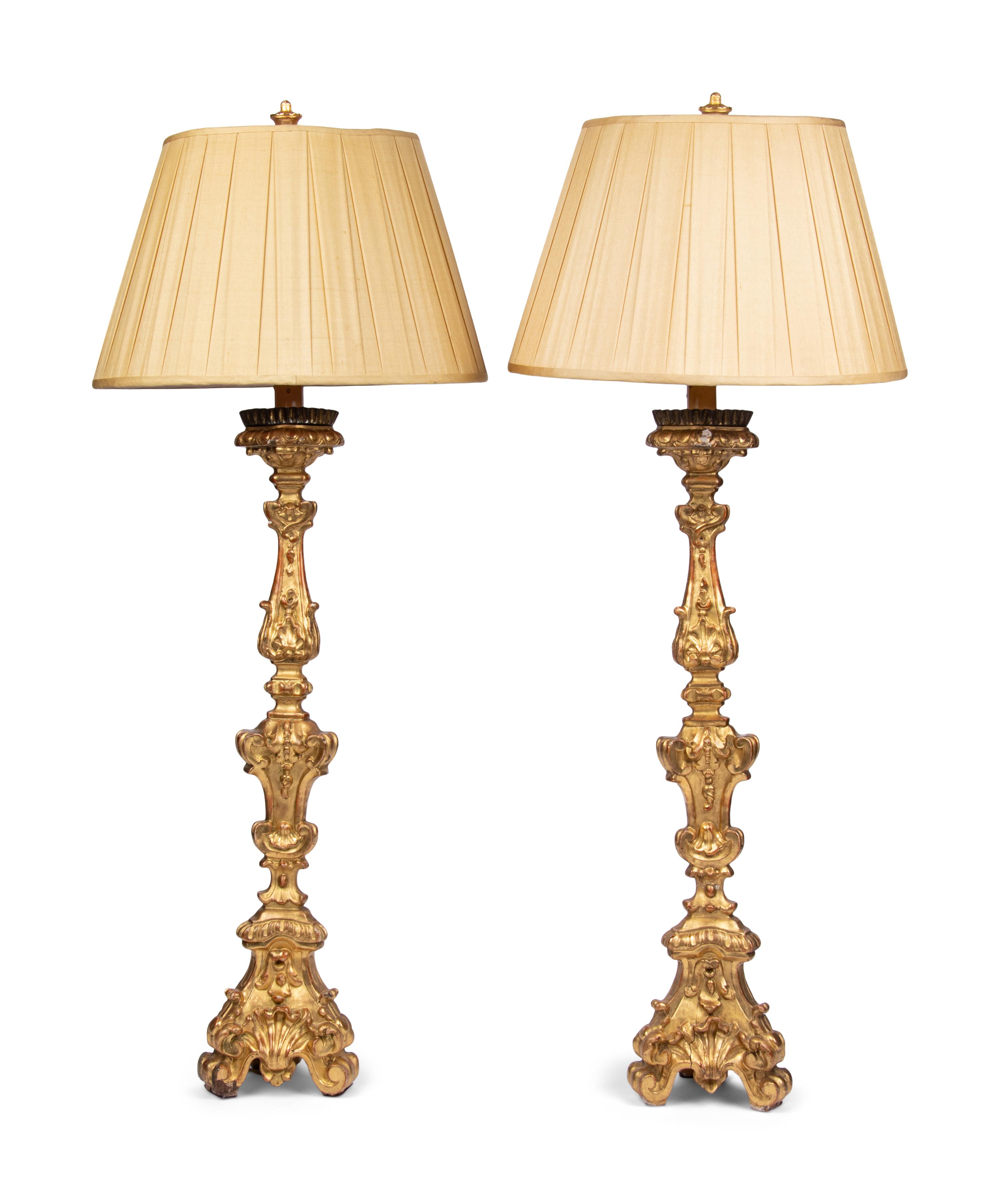 A Pair of Italian Giltwood Prickets Mounted as Lamps