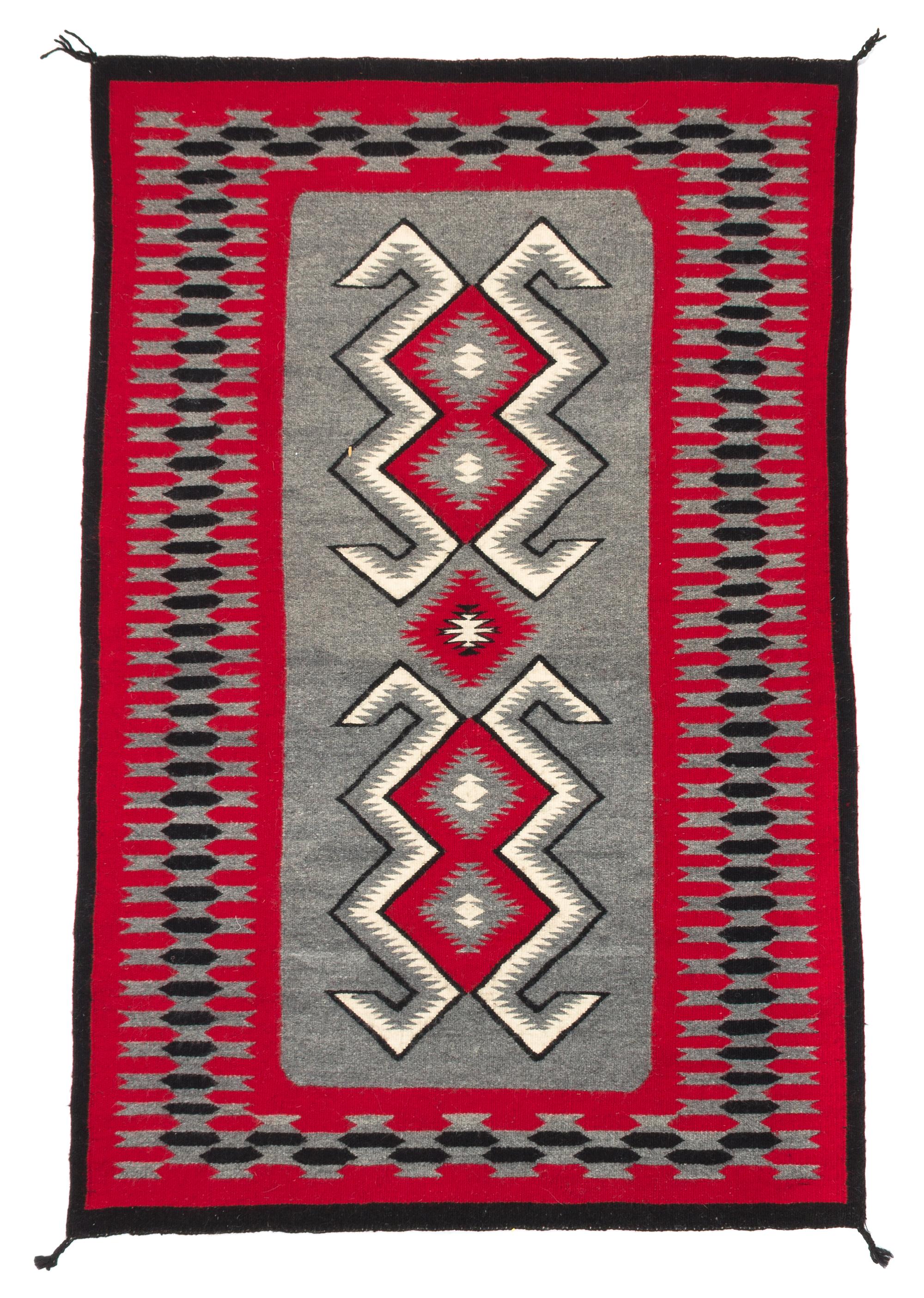 Three Navajo Rugs Length of largest 49 x width 32 1/2 inches.