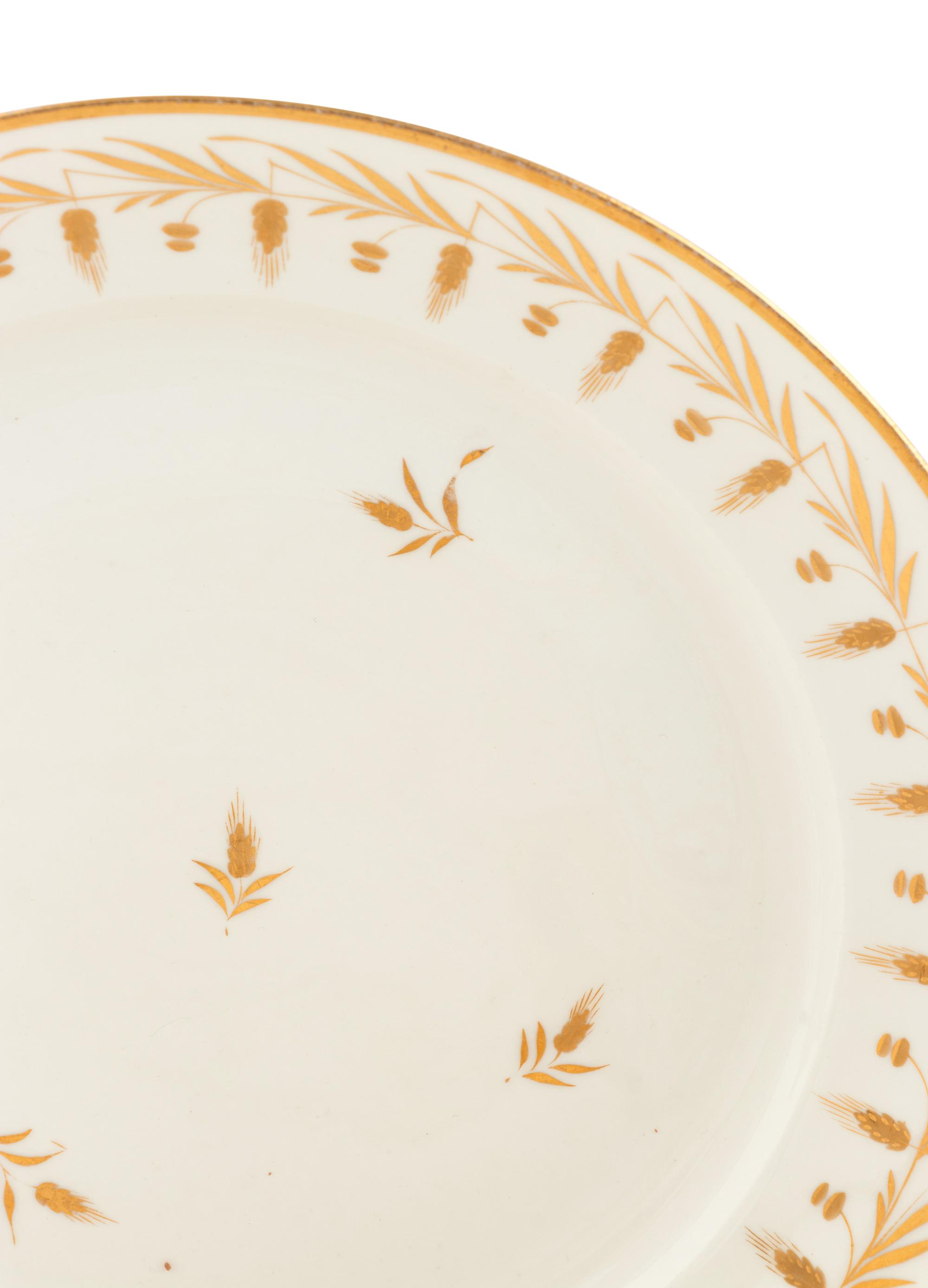 A Parcel-Gilt Porcelain Dinner Service