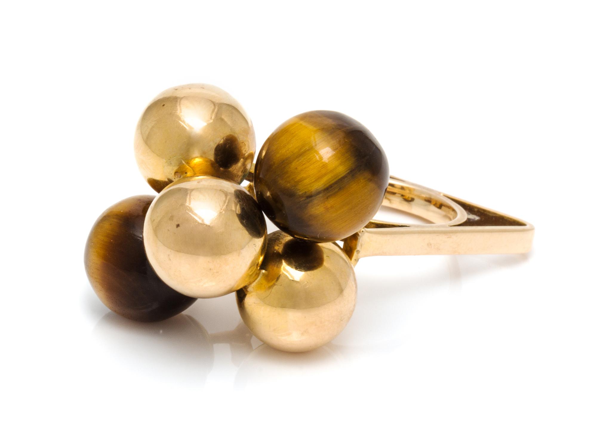 A Modernist Yellow Gold and Tiger's Eye Ring, 9.50 dwts.