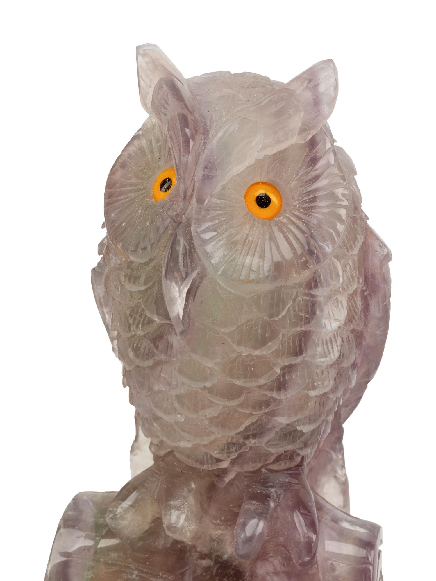 A Pair of Carved Amethyst Owls with Carved Wood Bases