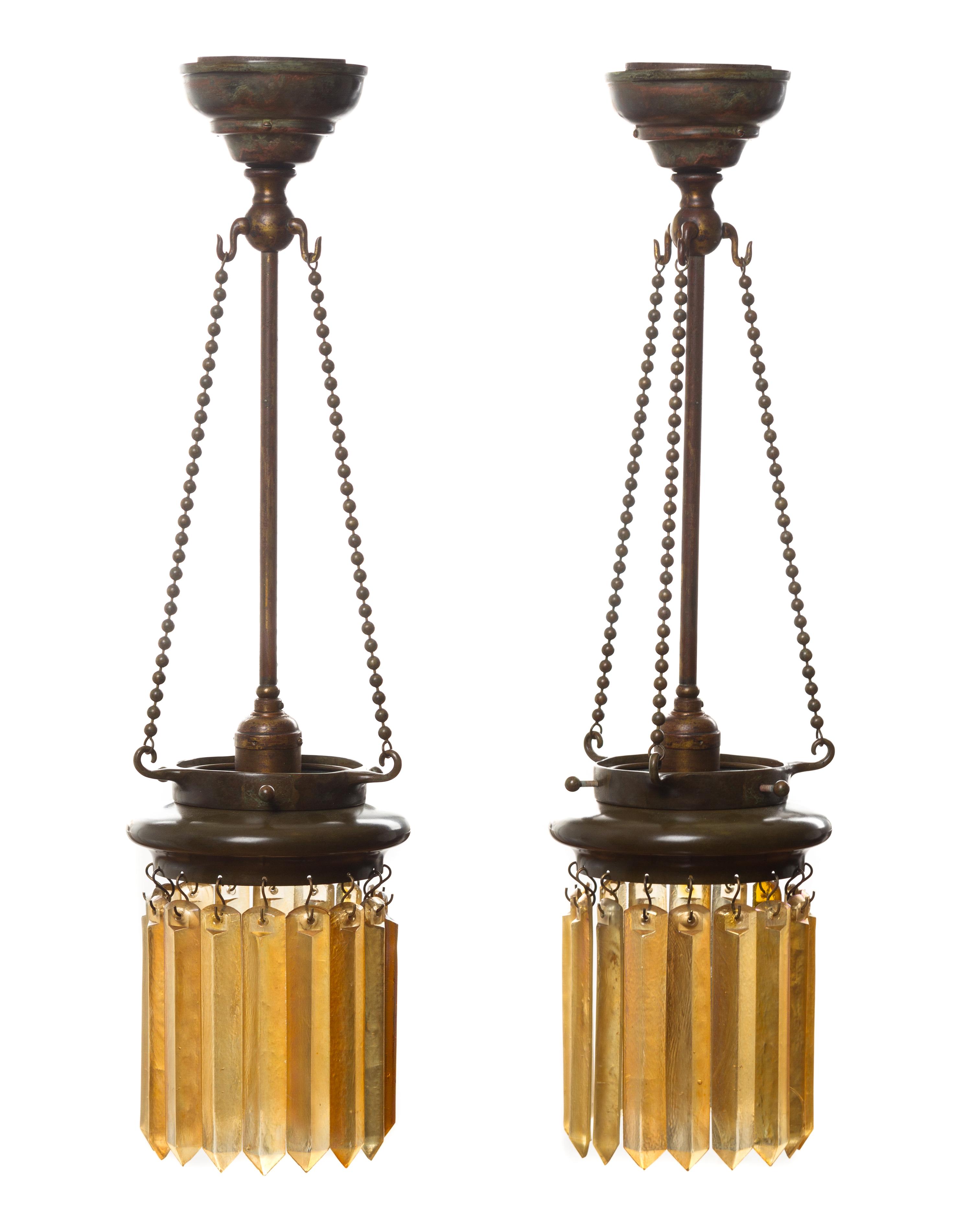A Pair of Tiffany Studios Favrile Glass and Bronze Lanterns Height overall 24 inches.