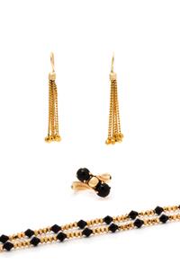 A Collection of Yellow Gold and Onyx Jewelry, 18.15 dwts.