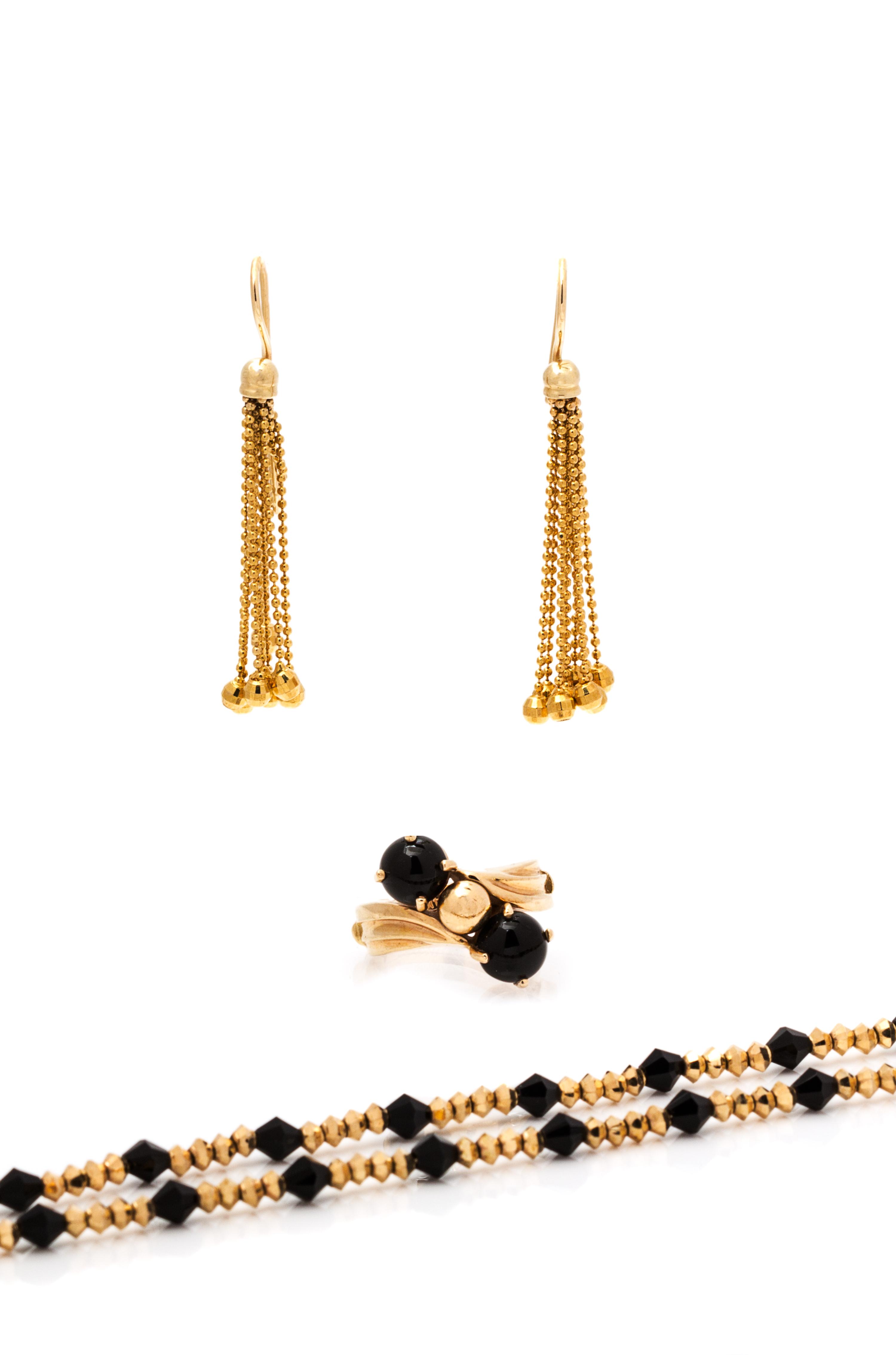 A Collection of Yellow Gold and Onyx Jewelry, 18.15 dwts.