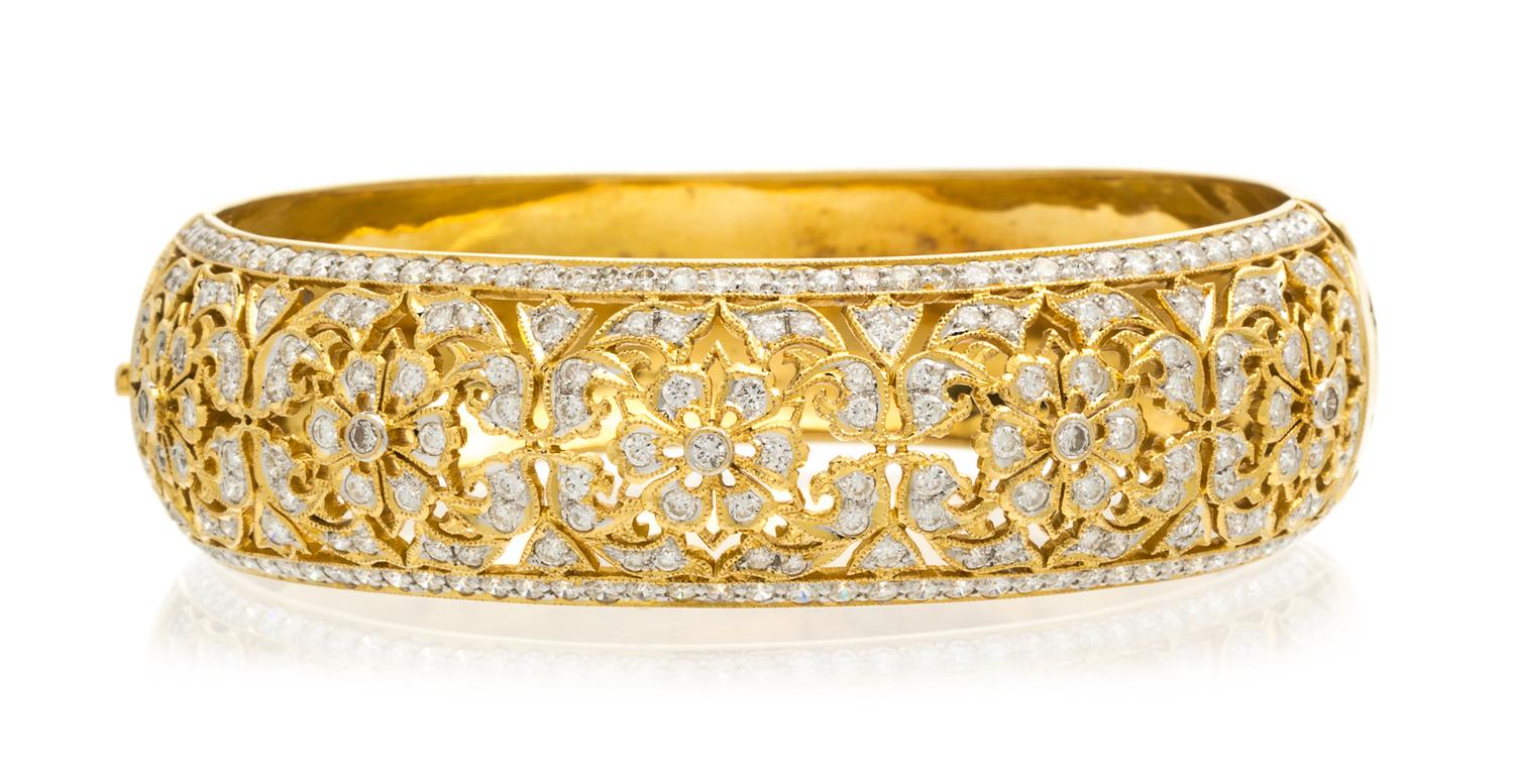 An 18 Karat Yellow Gold and Diamond Bangle Bracelet, 29.40 dwts.