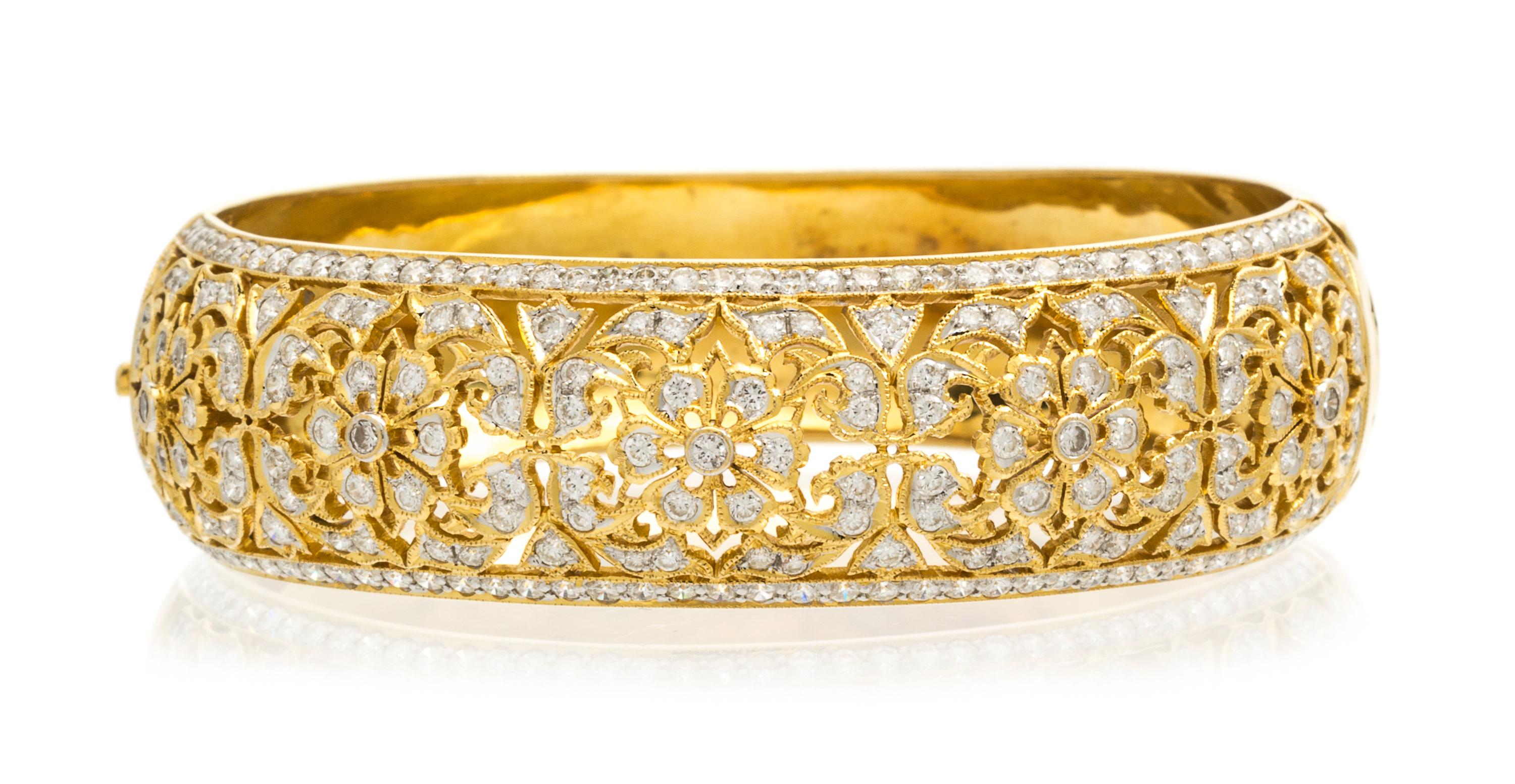 An 18 Karat Yellow Gold and Diamond Bangle Bracelet, 29.40 dwts.