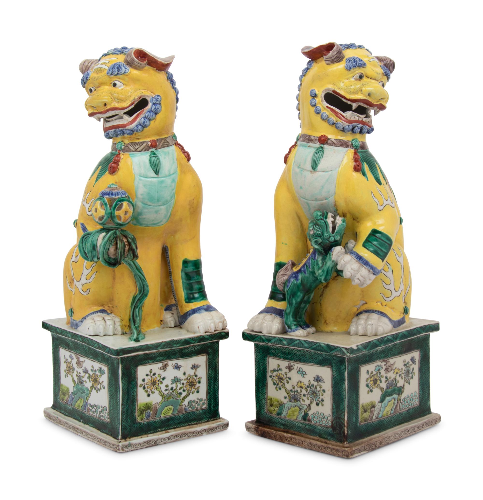 A Large Pair of Chinese Famille Jaune Porcelain Figures of Fu Lions