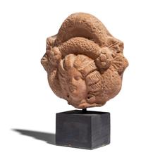 An Egyptian Terracotta Head of a Goddess