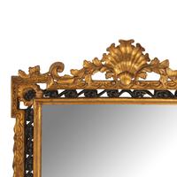 An Italian Giltwood and Part Ebonized Mirror