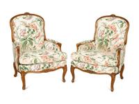 A Pair of Louis XV Style Walnut Bergères