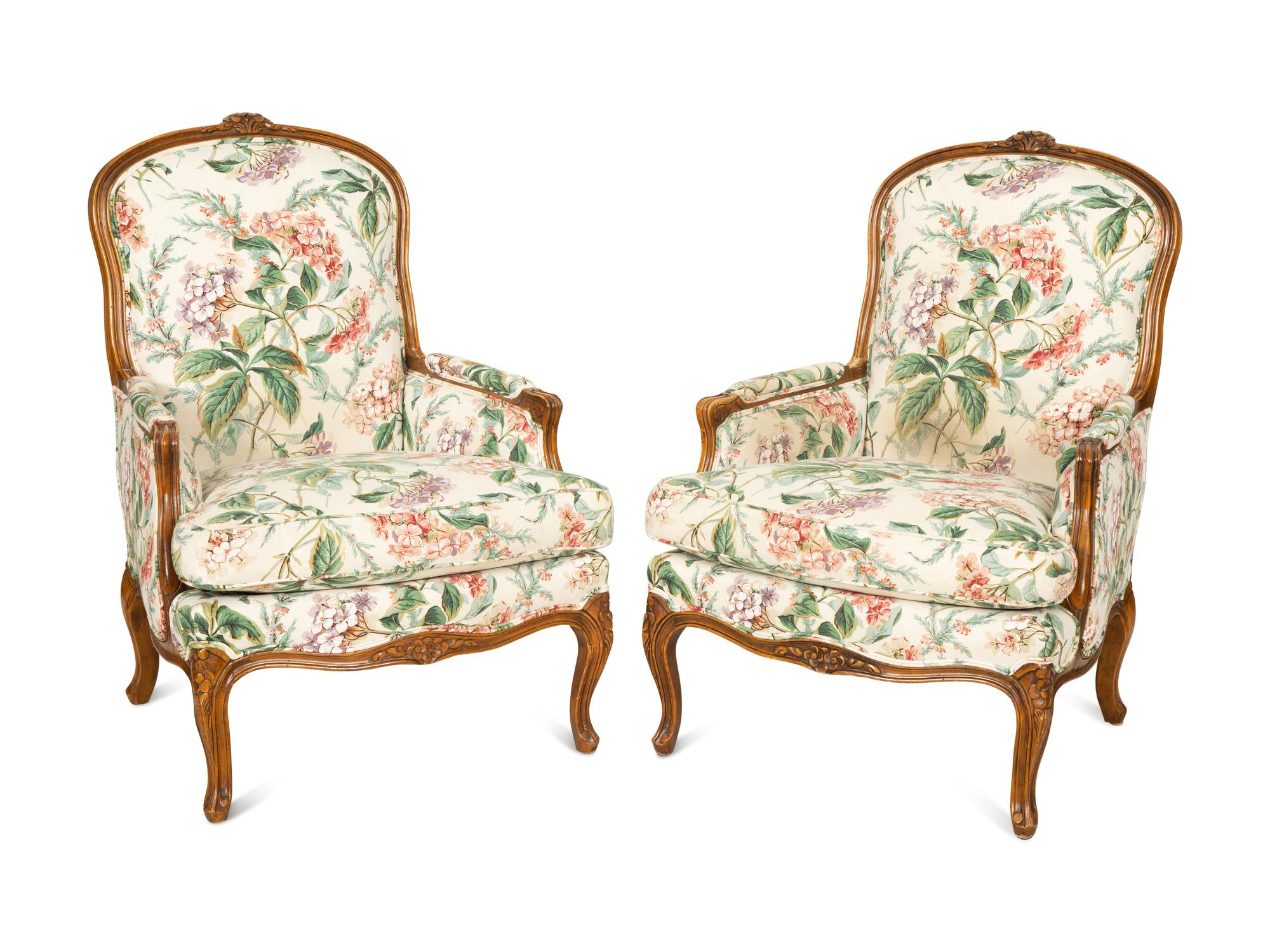 A Pair of Louis XV Style Walnut Bergères