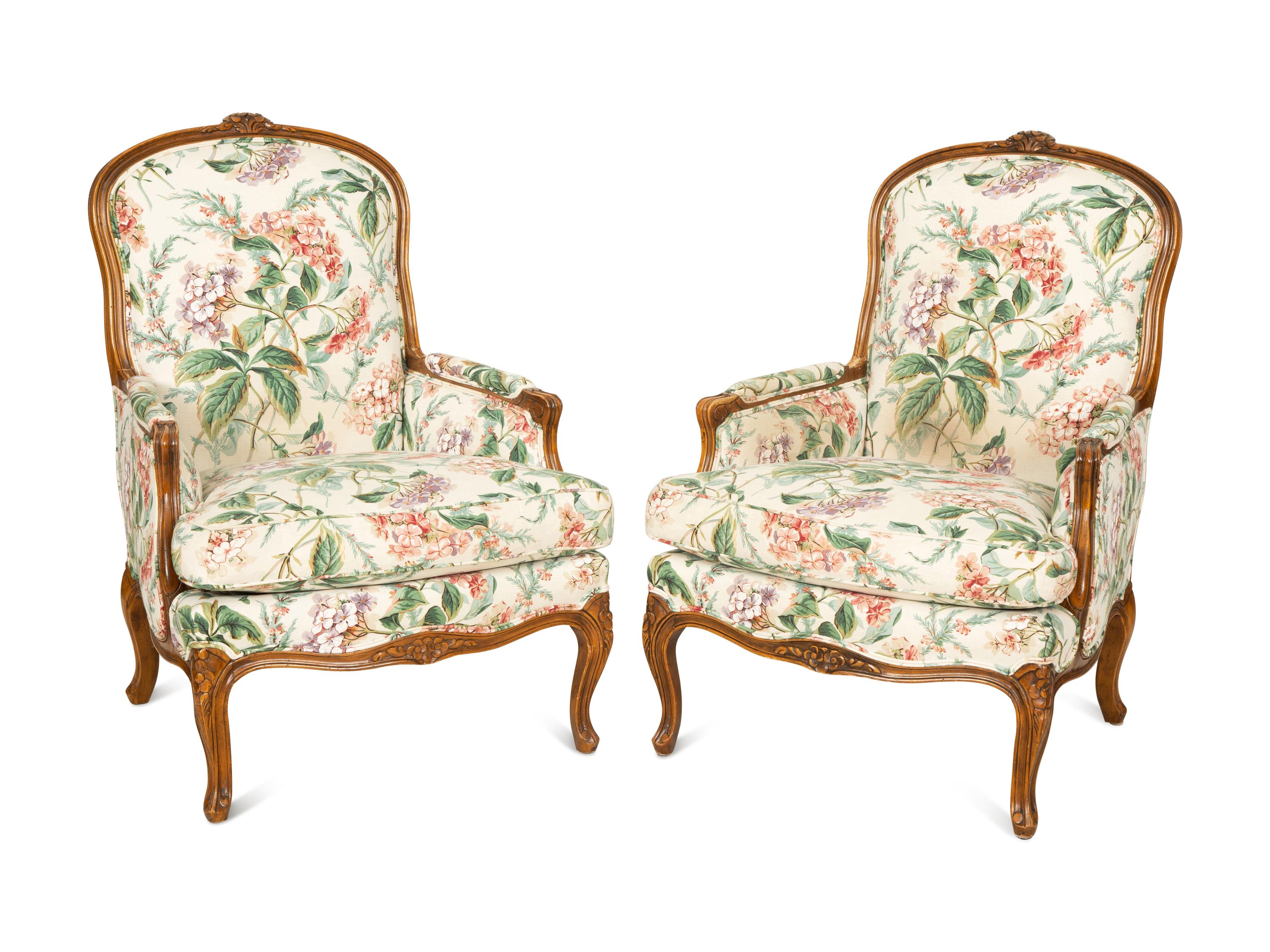 A Pair of Louis XV Style Walnut Bergères