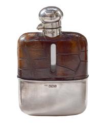 A Set of Three Silver and Stamped Leather Hip Flasks Left: 2.25" x .5" x 3.75" tall: Middle: 3" x 1" x 5" tall: Right: 3.25" x 1" x 5.5 — England, Circa 1925-1940