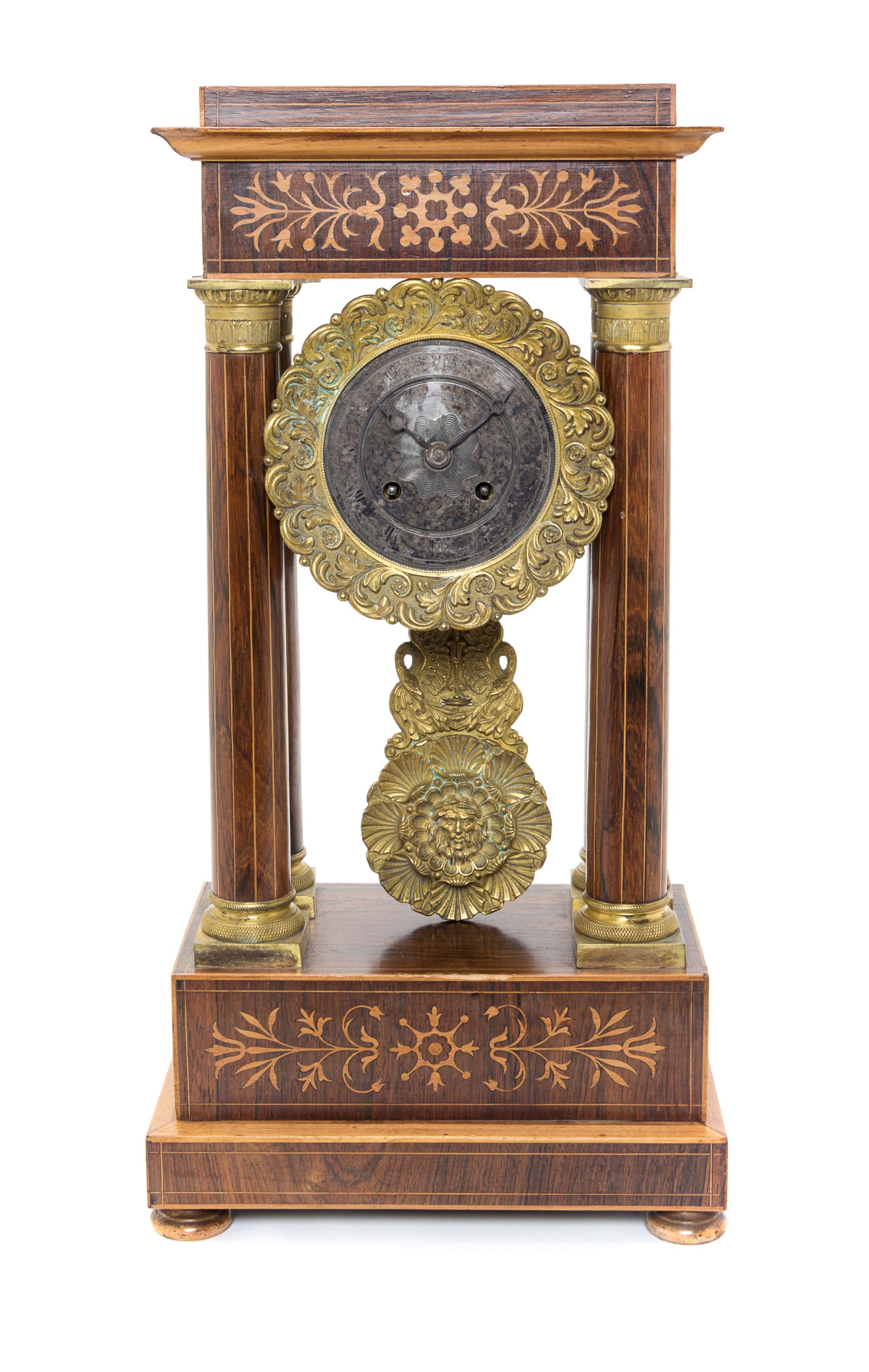 A Napoleon III Rosewood and Marquetry Portico Clock Height 18 inches. — THIRD QUARTER 19TH CENTURY