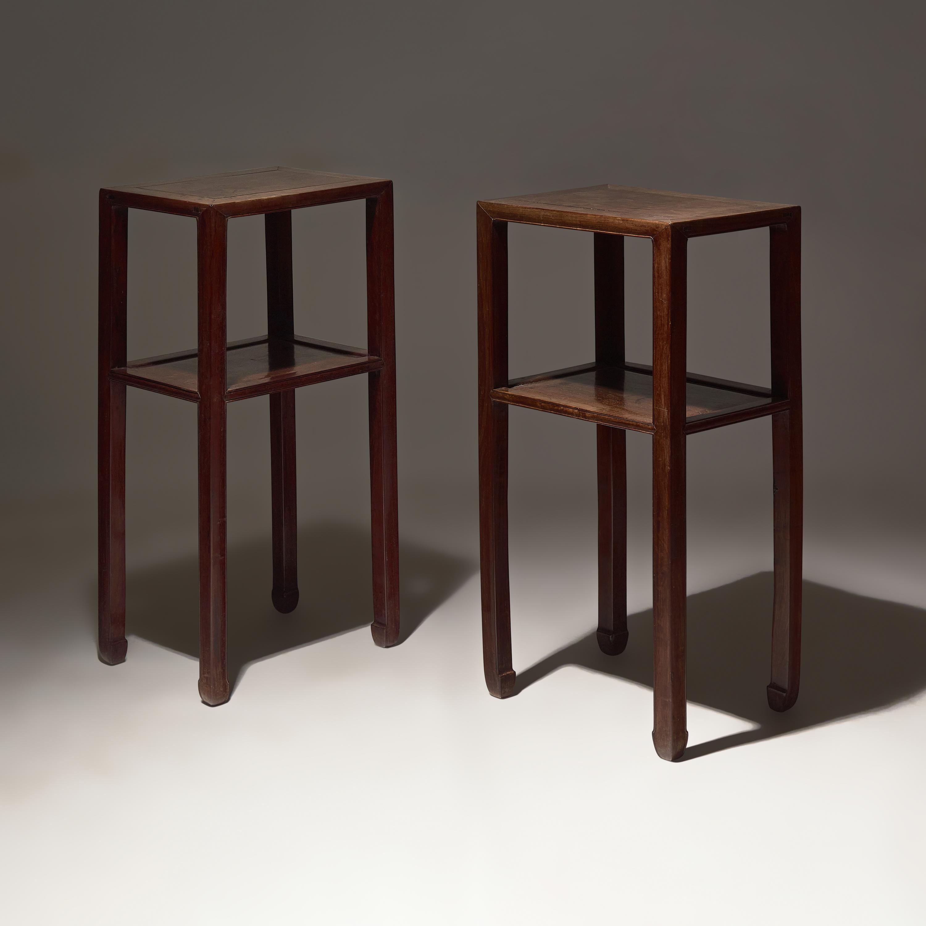 A Pair of Chinese Hardwood, Possibly Huanghuali, Stands, Qing Dynasty, 18th Century — 清中期 或爲黃花梨邊几一對