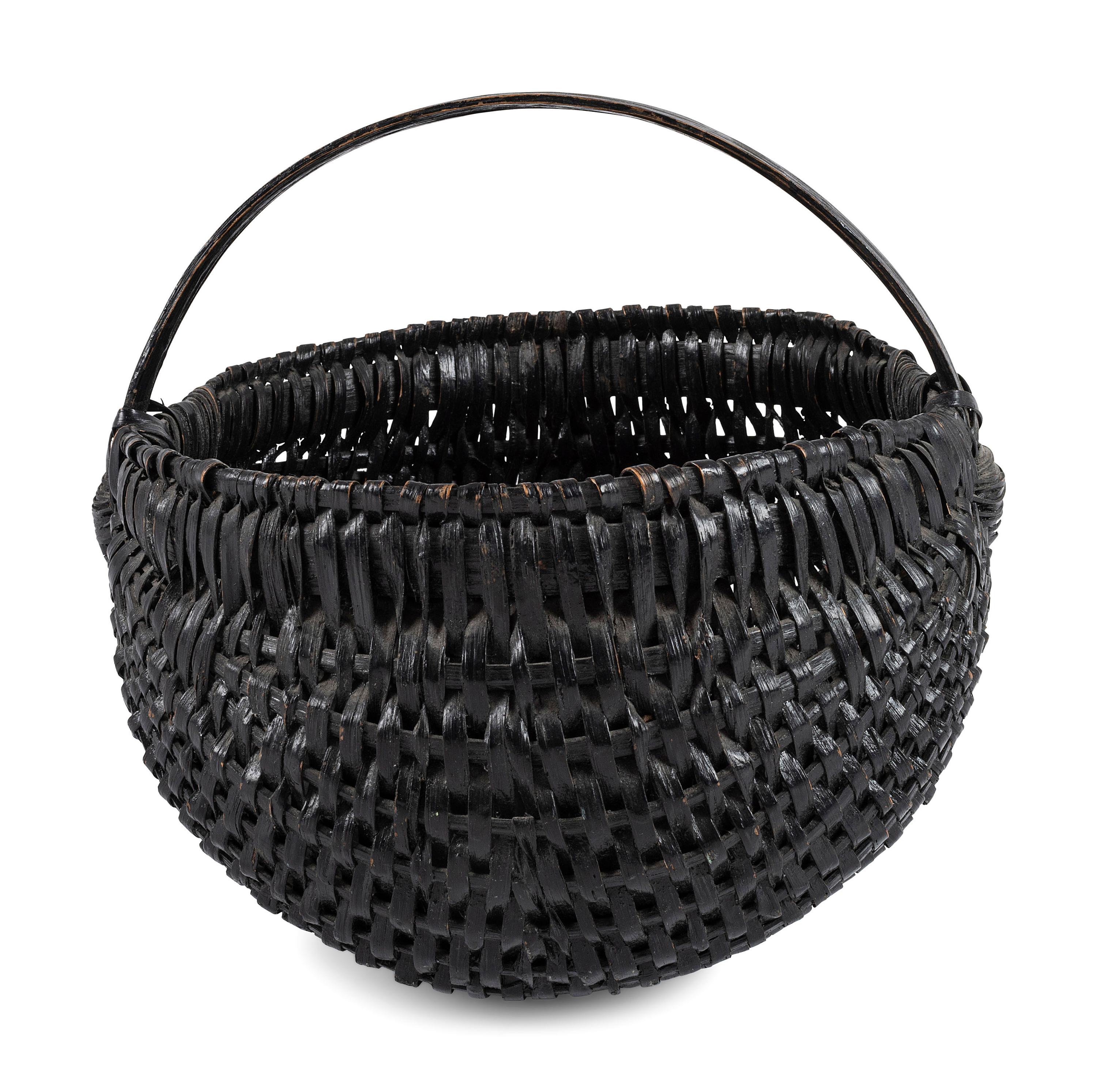 A Woven Buttocks Basket in Black Paint