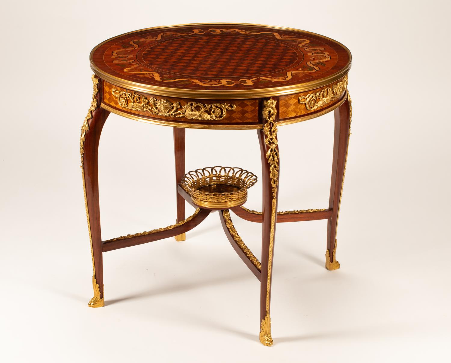 A Louis XV Style Gilt Bronze Mounted Marquetry Table