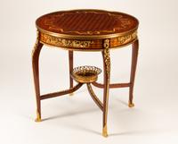 A Louis XV Style Gilt Bronze Mounted Marquetry Table