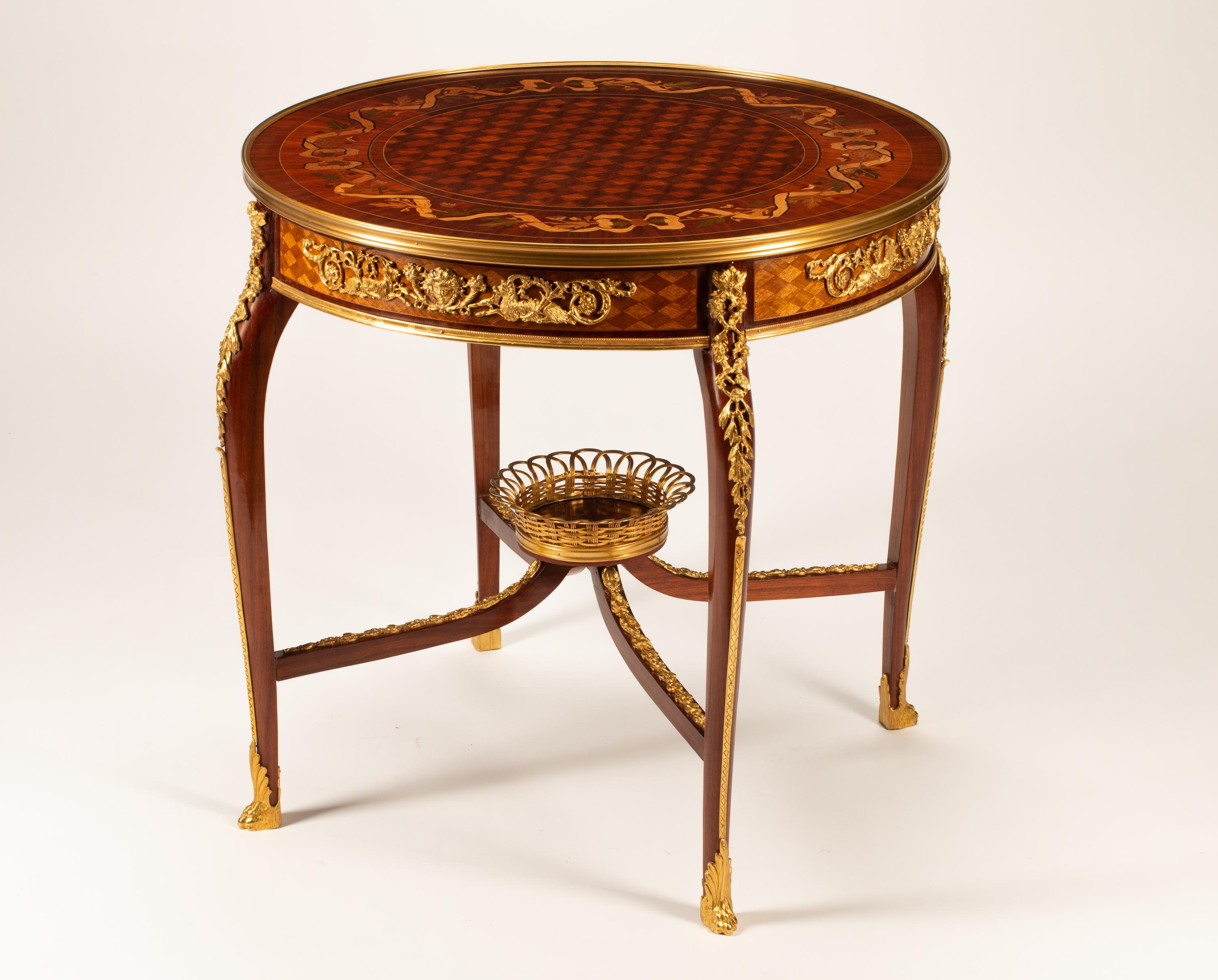 A Louis XV Style Gilt Bronze Mounted Marquetry Table