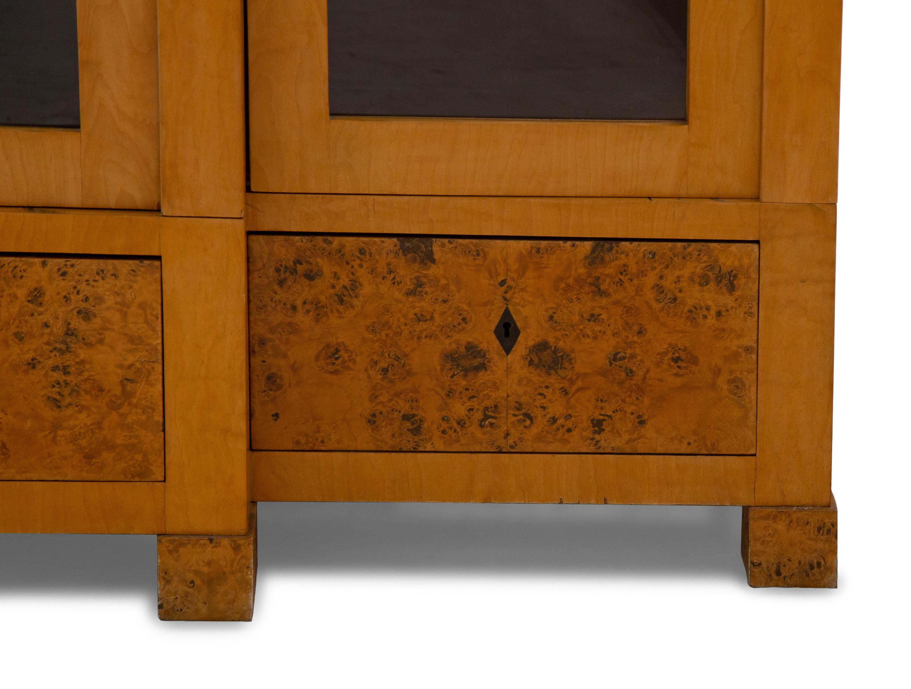 A German Neoclassical Birch Breakfront Bookcase