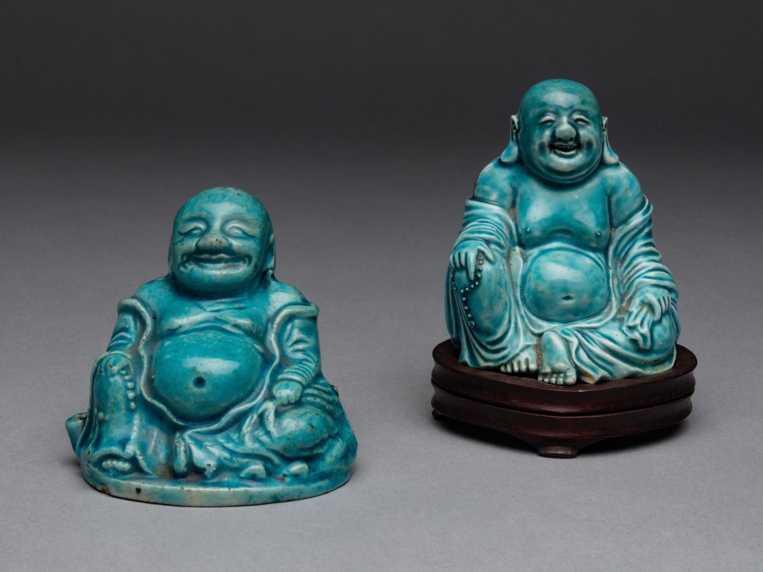 Two Turquoise Glazed Porcelain Figures of Budai Buddhas