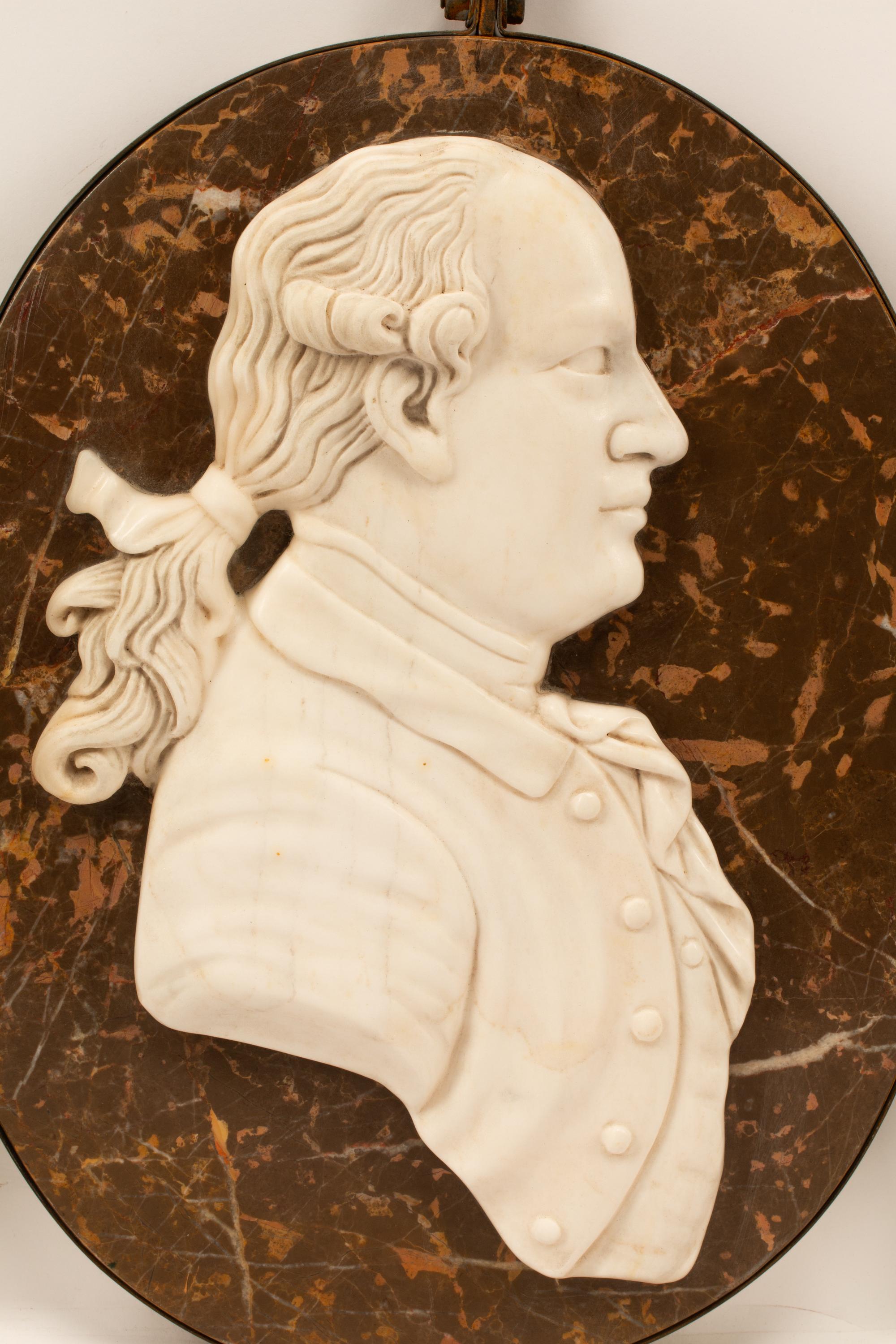 A Set of Four Iron-Framed Marble Portrait Medallions