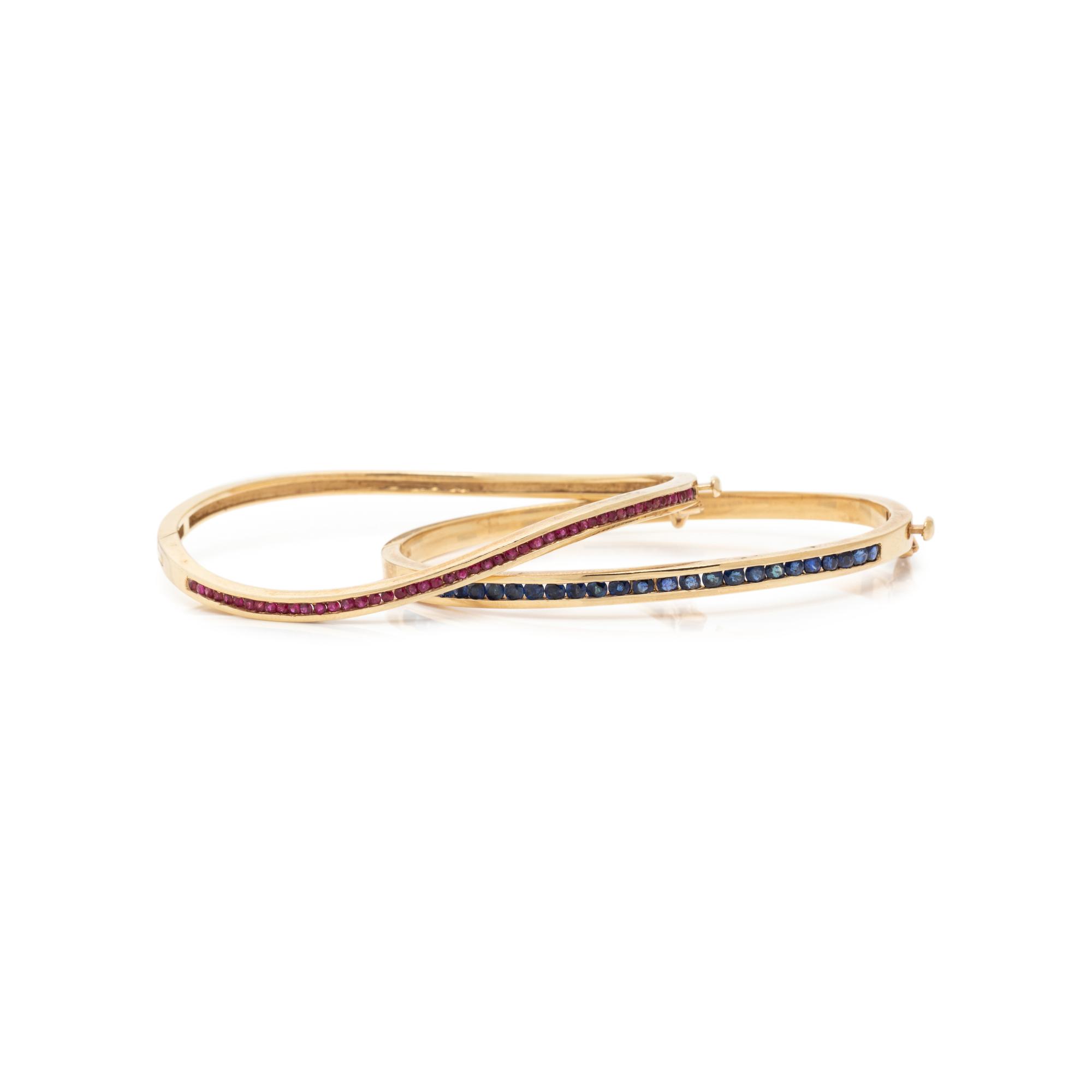 COLLECTION OF YELLOW GOLD AND GEMSTONE BANGLE BRACELETS