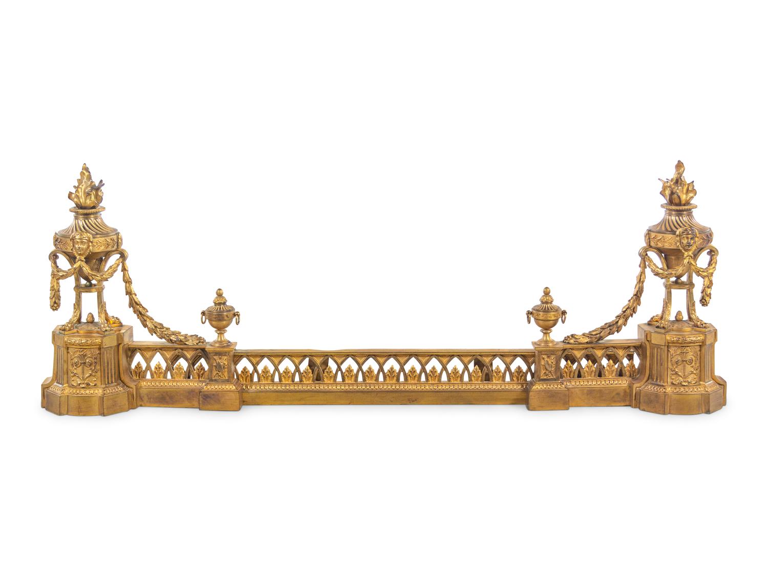 A Louis XVI Style Gilt Bronze Fire Fender with Flaming Urns