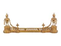 A Louis XVI Style Gilt Bronze Fire Fender with Flaming Urns